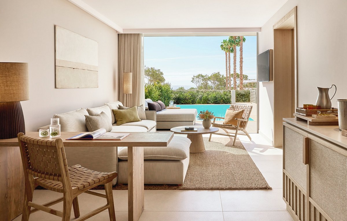 Luxury hotel suite with custom wood furniture and lounge seating, European hospitality furniture