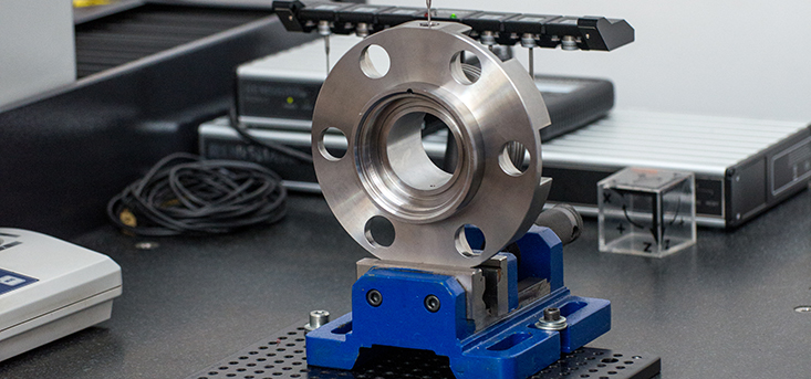Precision CNC machined stainless steel component with measurement verification, European metal production