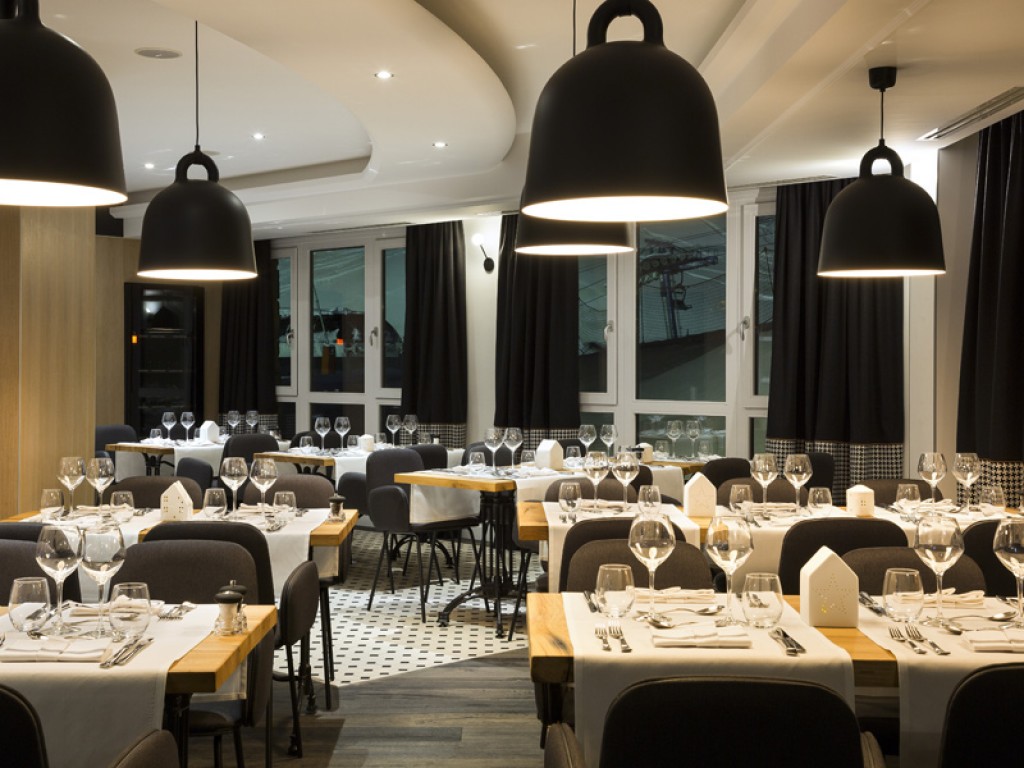 Restaurant dining room with reclaimed oak table tops for HoReCa interior project