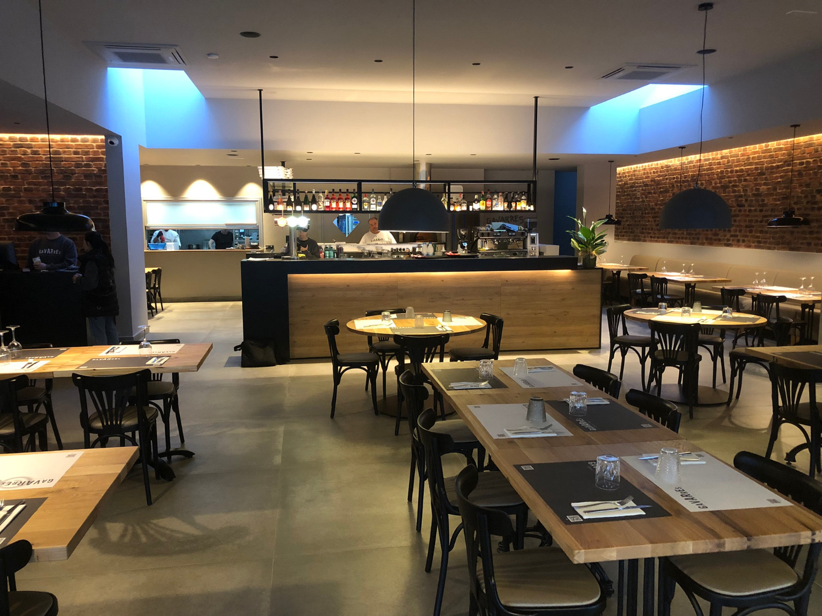 Full restaurant setup with solid wood dining tables and bistro chairs, European supplier